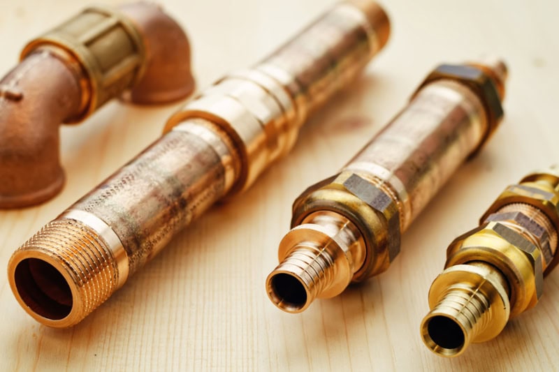 tools plumbing on a light woody background.
